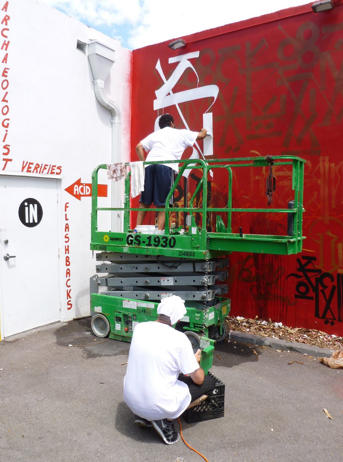 RETNA Wynwood Walls Miami mural with calligraphy on dark background